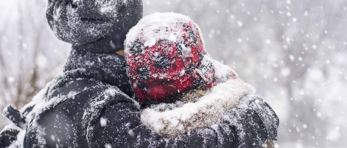 two people wearing winter hats