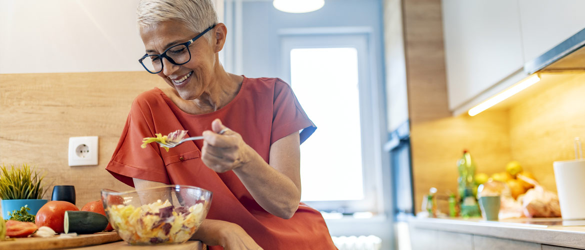 mature woman eating salad