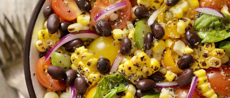 corn, black beans and onion in a bowl