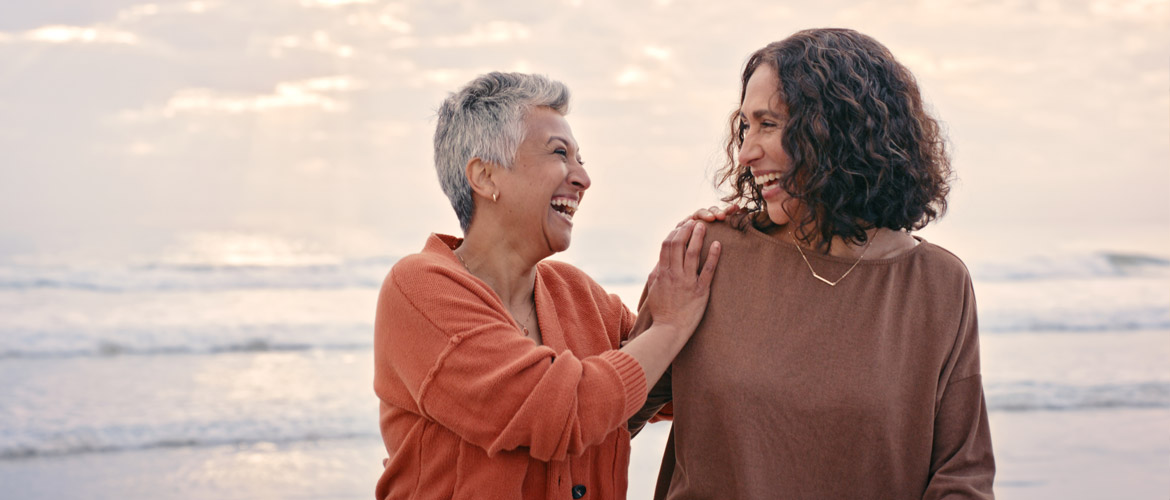 two women laughing and walking