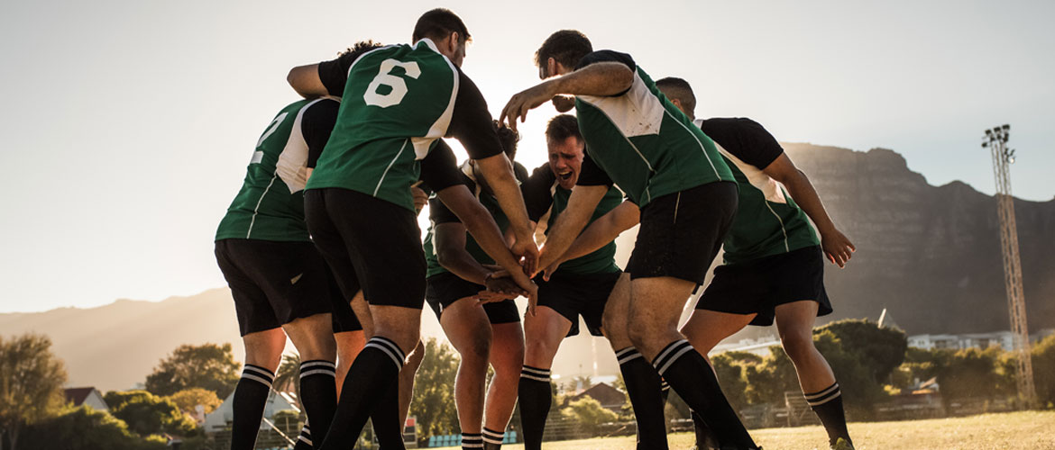 mens soccer team in huddle