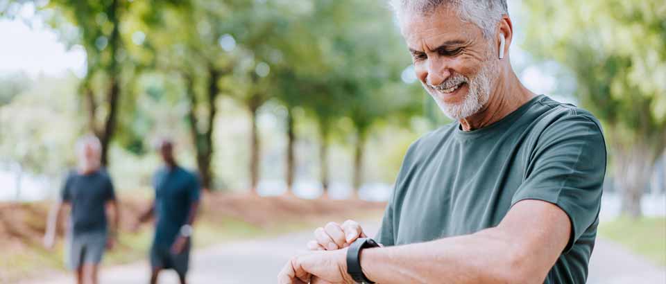 a man checking his watch as he works out