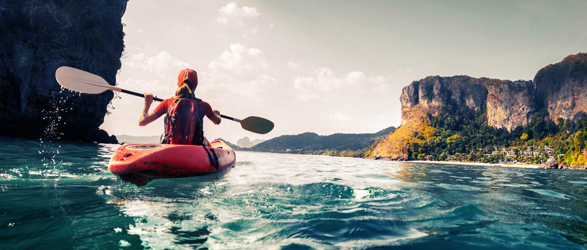 girl kayaking in canyon