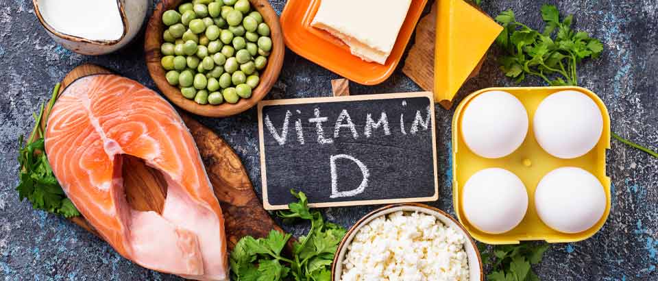 salmon eggs and beans sitting on a table with a sign that says vitamin d