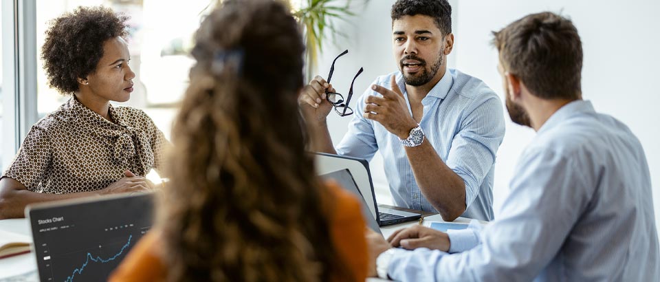 Man sitting in work meeting stressed