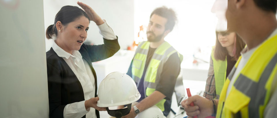 person demonstrating how to wear a hard hat