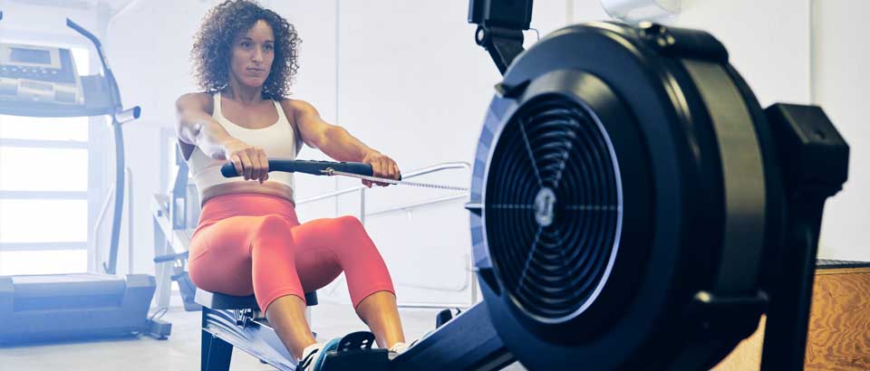 women on rowing machine