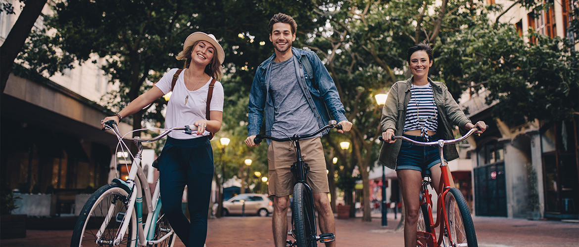 group of young adults riding bicycles