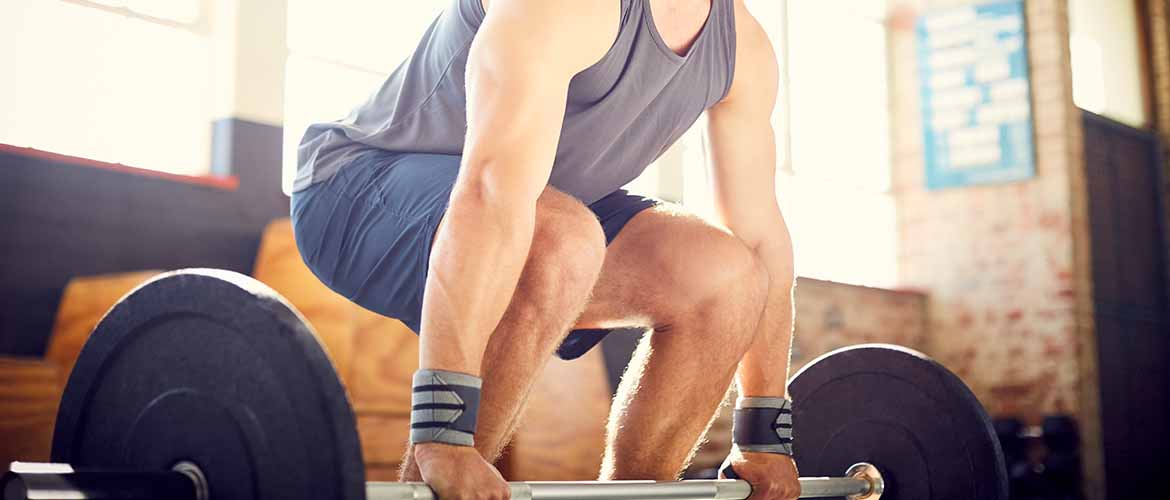 a person lifting weights in a gym