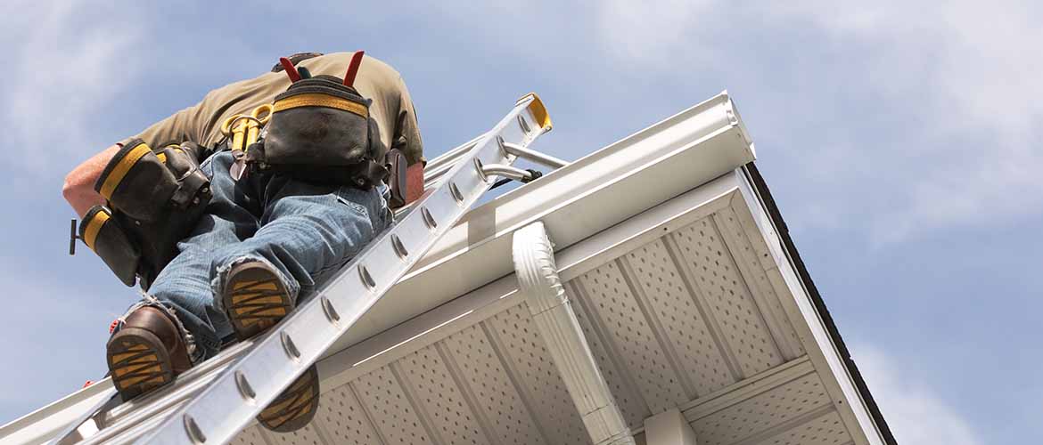 construction worker climbing ladder