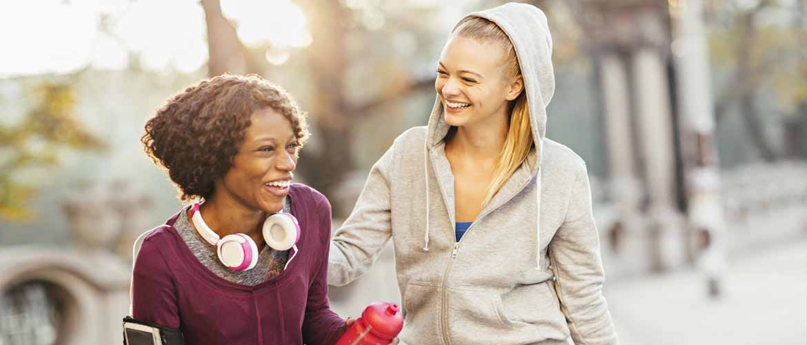 two women talking while on a walk with each other