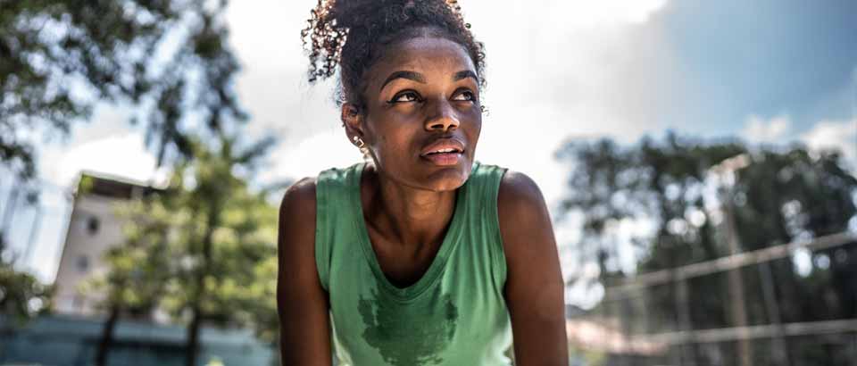 a women catching her breath working out