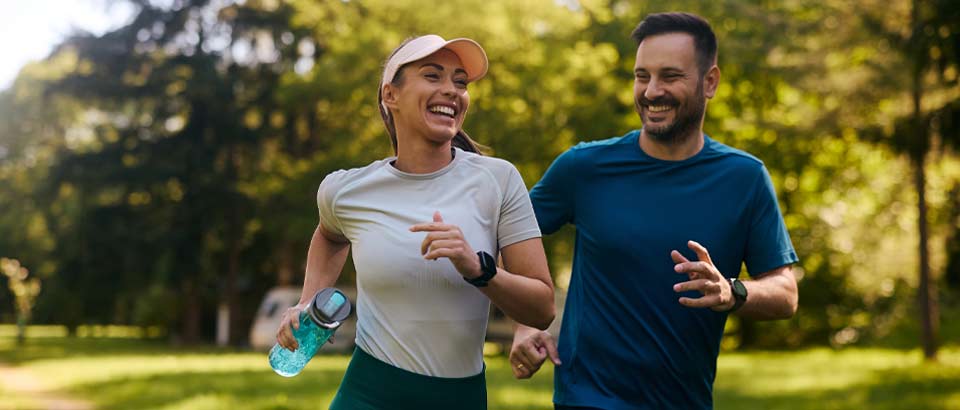 couple running and smiling at each other