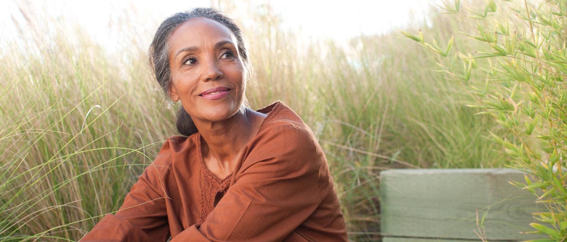 a older woman sitting outside