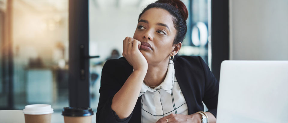 a women feeling tired at work